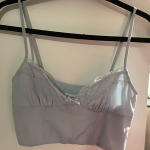 Princess Polly blue cropped tank top with lace details and hidden zipper.